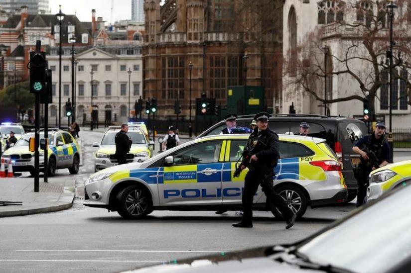 FILE PHOTO: Armed police respond outside Parliament during an incident on Westminster Bridge in London, Britain Mar 22, 2017. REUTERS