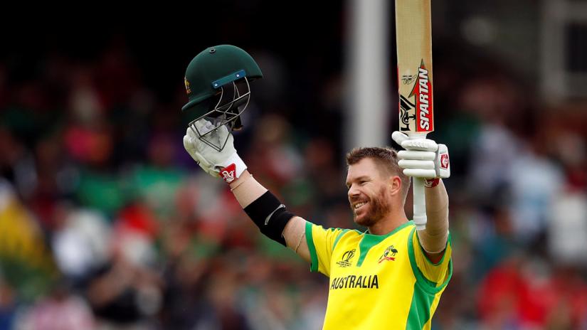 FILE PHOTO: Australia`s David Warner celebrates his century against Bangladesh in a Cricket World Cup match on Jun 20 in Nottingham, England. REUTERS