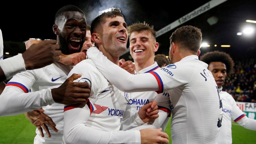 FILE PHOTO: Soccer Football - Premier League - Burnley v Chelsea - Turf Moor, Burnley, Britain - Oct 26, 2019 Chelsea`s Christian Pulisic celebrates scoring their third goal to complete his hat-trick with team mates Action Images via Reuters