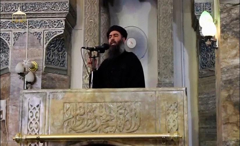 FILE PHOTO: A man purported to be the reclusive leader of the militant Islamic State Abu Bakr al-Baghdadi has made what would be his first public appearance at a mosque in the centre of Iraq`s second city, Mosul, according to a video recording posted on the Internet on July 5, 2014, in this still image taken from video. Social Media Website via Reuters TV/File Photo
