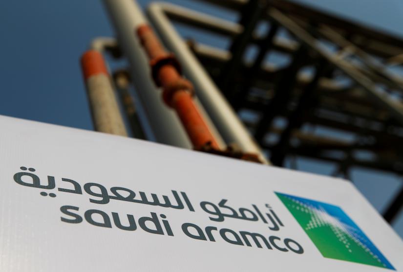 FILE PHOTO: The Saudi Aramco logo pictured at the company`s oil facility in Abqaiq, Saudi Arabia, October 12, 2019. REUTERS