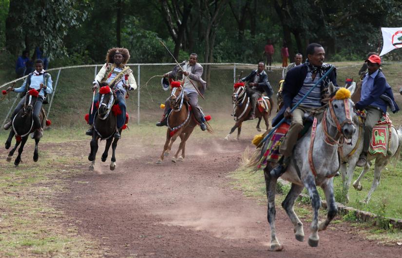 Men ride traditionally outfitted horses during a celebration rally for Ethiopia`s Prime Minister Abiy Ahmed after he won the Nobel Peace Prize in Ambo, Oromia region of Ethiopia, October 13, 2019. REUTERS