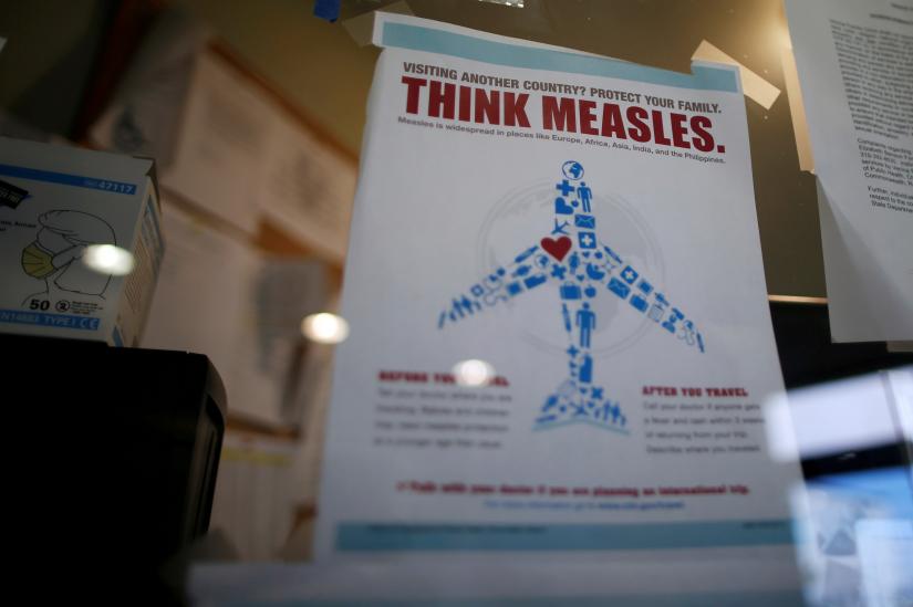 FILE PHOTO: A vial of the measles, mumps, and rubella (MMR) vaccine is pictured at the International Community Health Services clinic in Seattle, Washington, U.S., March 20, 2019. Picture taken March 20, 2019. REUTERS