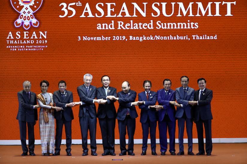 Leaders of the Association of Southeast Asian Nations shake hands at the Opening Ceremony of the 35th ASEAN Summit in Bangkok, Thailand November 3, 2019. REUTERS