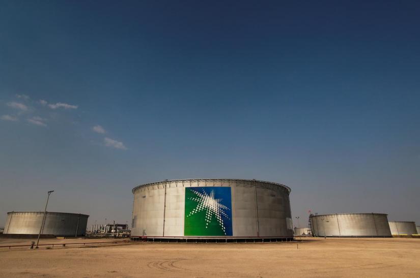 FILE PHOTO: A view shows branded oil tanks at Saudi Aramco oil facility in Abqaiq, Saudi Arabia Oct 12, 2019. REUTERS