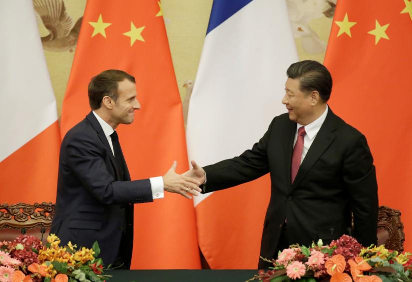 French President Emmanuel Macron shakes hands with China`s President Xi Jinping after a joint news conference at the Great Hall of the People in Beijing, China November 6, 2019. REUTERS