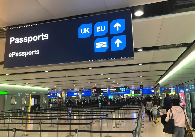 FILE PHOTO: Signage is seen at the UK border control point at the arrivals area of Heathrow Airport, London, September 3, 2018. REUTERS/Toby Melville