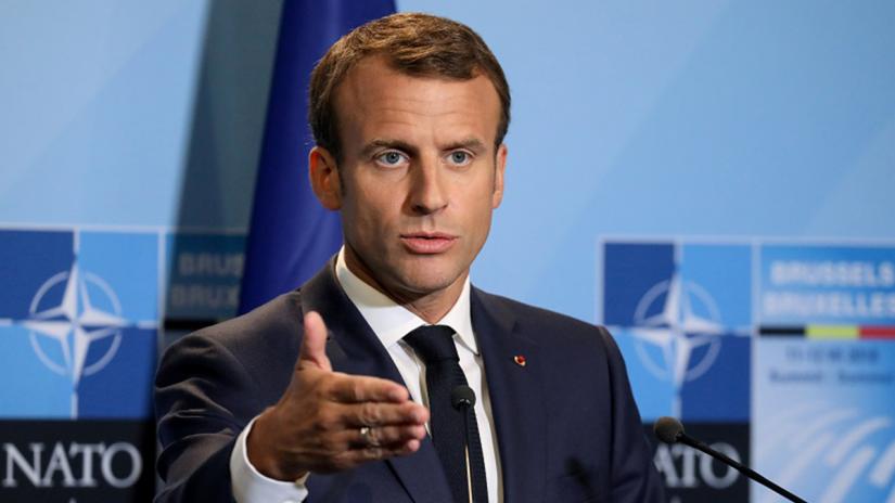 FILE PHOTO: French President Emmanuel Macron addresses a press conference on the second day of the North Atlantic Treaty Organization (NATO) summit in Brussels, Belgium, Jul 12, 2018. REUTERS