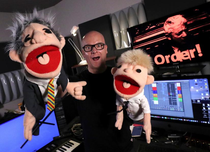 Belgian music producer Michael Schack, creator of the track `Order`, which mixes dance music with former speaker of British House of Commons John Bercow`s trademark ripostes, poses with puppets depicting Bercow and British Prime Minister Boris Johnson, in his studio in Antwerp, Belgium November 6, 2019.REUTERS