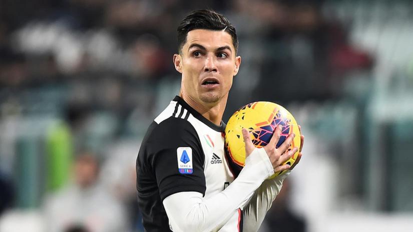 Soccer Football - Serie A - Juventus v AC Milan - Allianz Stadium, Turin, Italy - Nov 10, 2019 Juventus` Cristiano Ronaldo holds the ball REUTERS