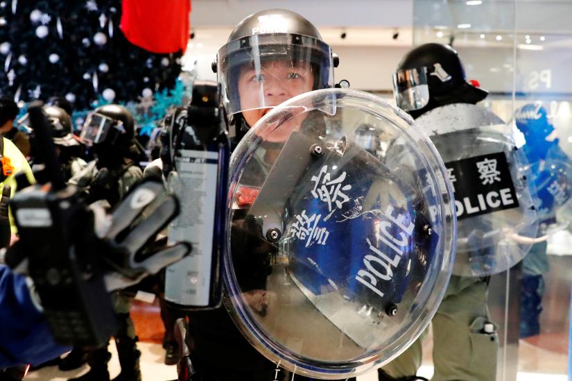 Riot police holds a pepper spray as he tries to disperse anti-government protesters, in Hong Kong, China November 10, 2019. REUTERS