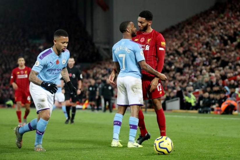 FILE PHOTO: Soccer Football - Premier League - Liverpool v Manchester City - Anfield, Liverpool, Britain - November 10, 2019 Liverpool`s Joe Gomez and Manchester City`s Raheem Sterling clash Action Images via Reuters