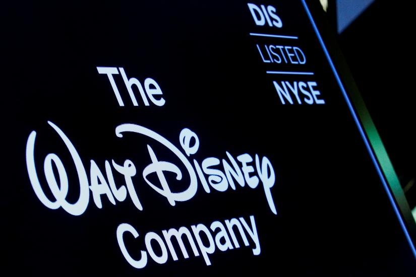 A screen shows the logo and a ticker symbol for The Walt Disney Company on the floor of the New York Stock Exchange (NYSE) in New York, U.S., December 14, 2017. REUTERS/File Photo