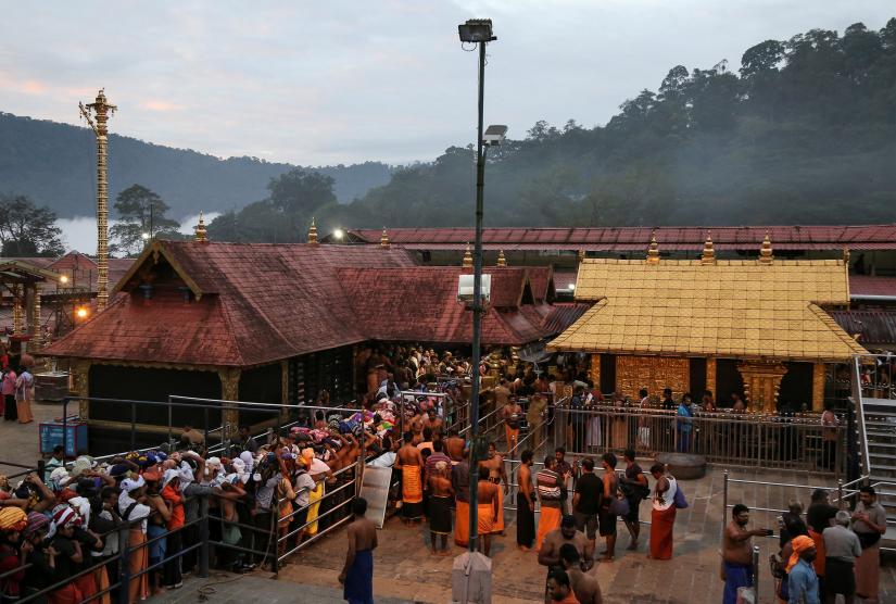 FILE PHOTO: Hindu devotees wait in queues inside the premises of the Sabarimala temple in Pathanamthitta district in the southern state of Kerala, India, October 18, 2018. REUTERS