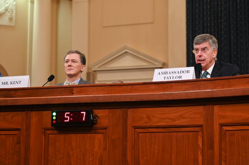 George Kent, the deputy assistant secretary of state for European and Eurasian affairs and William Taylor, the top U.S. diplomat in Ukraine, testify in a House Intelligence Committee impeachment inquiry hearing into U.S. President Donald Trump on Capitol Hill in Washington, U.S., November 13, 2019. REUTERS