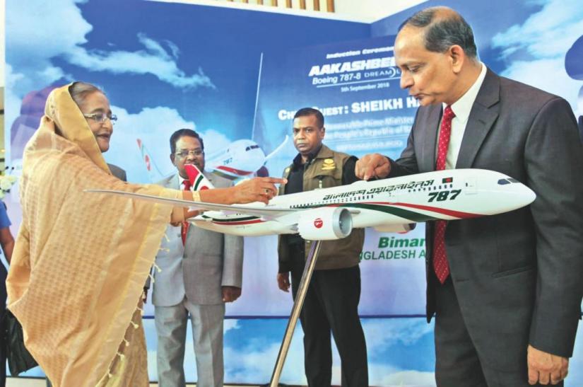 Prime Minister Sheikh Hasina looks at a scale model of Biman`s new Boeing 787 Dreamliner at Hazrat Shahjalal International Airport on September 06, 2018. Photo: PID