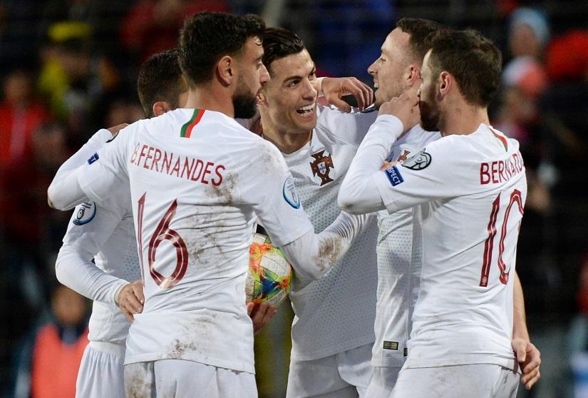 Soccer Football - Euro 2020 Qualifier - Group B - Luxembourg v Portugal - Stade Josy Barthel, Luxembourg City, Luxembourg - November 17, 2019 Portugal`s Cristiano Ronaldo celebrates scoring their second goal with team mates REUTERS