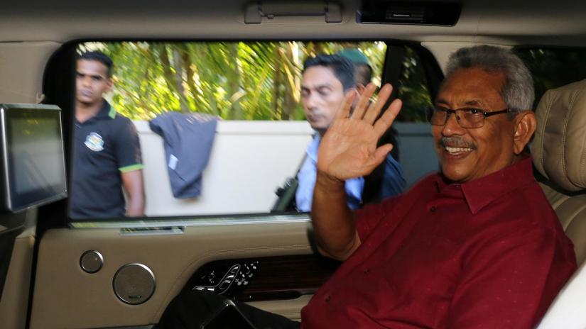President-elect Gotabaya Rajapaksa waves at his supporters as he leaves his house in Colombo, Sri Lanka Nov 17, 2019. REUTERS