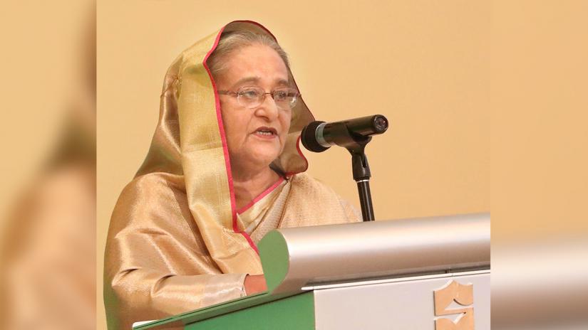 Prime Minister Sheikh Hasina addressing a dinner reception on Tuesday (Nov 19) arranged in honour of her by the Bangladesh Embassy at Shangri-La Hotel in Abu Dhabi. FOCUS BANGLA