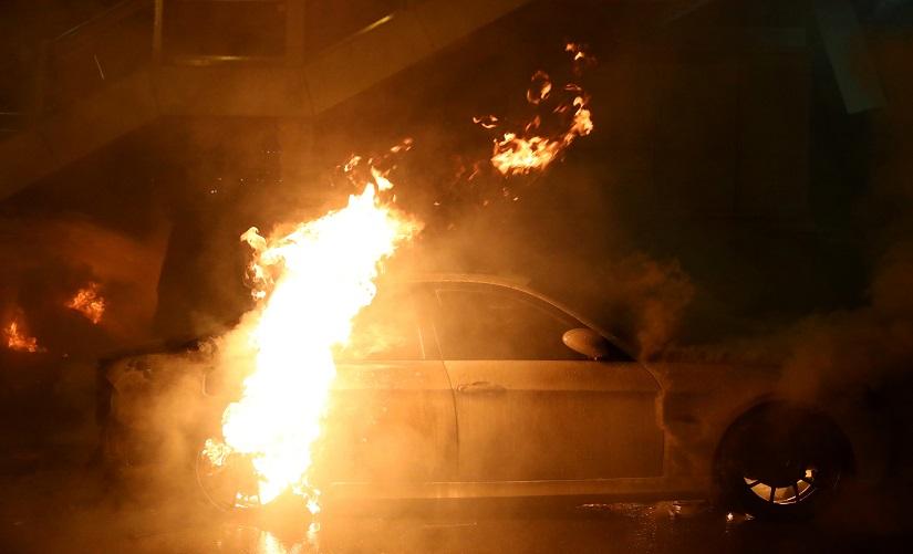 A car burns during clashes between anti-government protesters and riot police at Tsim Sha Tsui, in Hong Kong, China, Nov 19, 2019. REUTERS