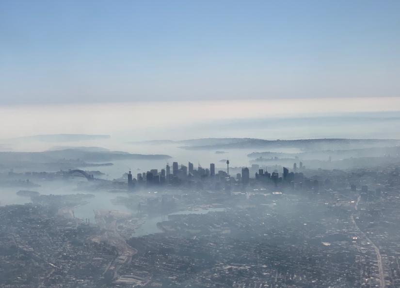An image taken on a smart phone from a plane window shows smoke haze blanketing Sydney, Australia, November 19, 2019. AAP Image/Neil Bennett/via REUTERS
