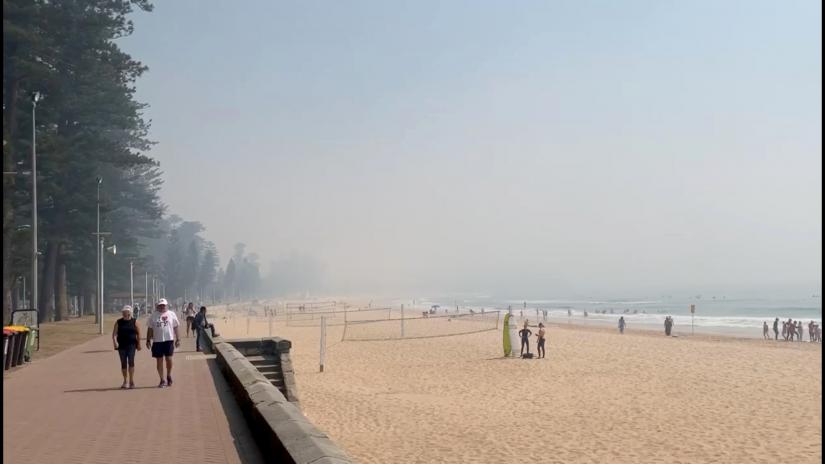 A still image taken from a social media video shows haze blanketing Manly Beach in Sydney, Australia November 19, 2019. SYDNEY COACHES via REUTERS