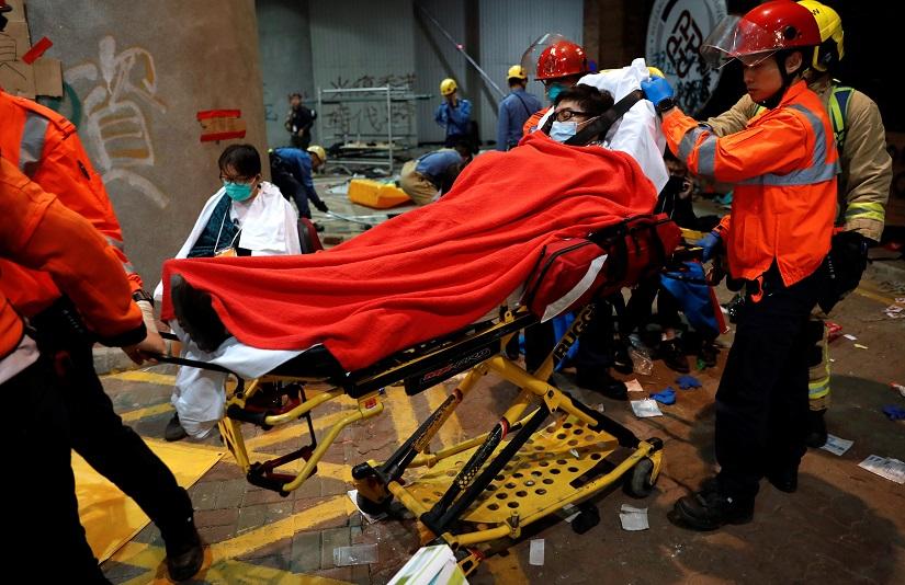 Protesters wait to receive medical attention at the Hong Kong Polytechnic University campus during protests in Hong Kong, China, Nov 19, 2019. REUTERS