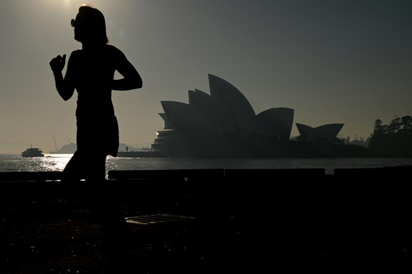The Sydney Opera House is seen as a smoke haze hits Sydney, Australia, November 19, 2019. AAP Image/Joel Carrett/via REUTERS