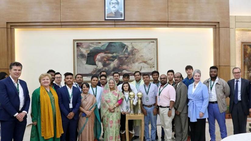 Prime Minister Sheikh Hasina along with the players participating in `Sheikh Russel International Club Tennis Tournament - 2019` on Wednesday (Nov 20). Focus Bangla