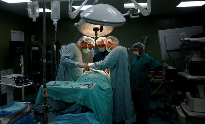 Current research focuses on how robots can be used by surgeons to improve patient and surgeon safety./REUTERS.