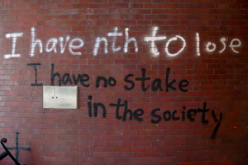 A message is written in graffiti on the campus of the Hong Kong Polytechnic University (PolyU) in Hong Kong, China November 21, 2019. REUTERS