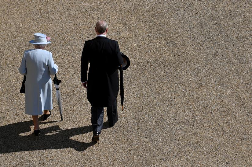 FILE PHOTO: Britain`s Queen Elizabeth II and Prince Andrew, Duke of York, arrive for the Royal Garden Party at Buckingham Palace in London, Britain May 21, 2019.Pool via REUTERS/File Photo