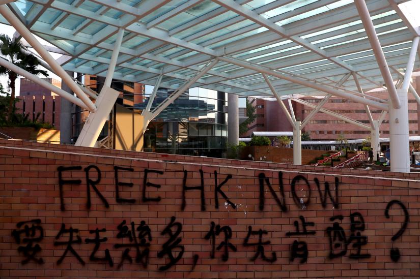 A message is written in graffiti on the campus of the Hong Kong Polytechnic University (PolyU) in Hong Kong, China November 21, 2019. REUTERS
