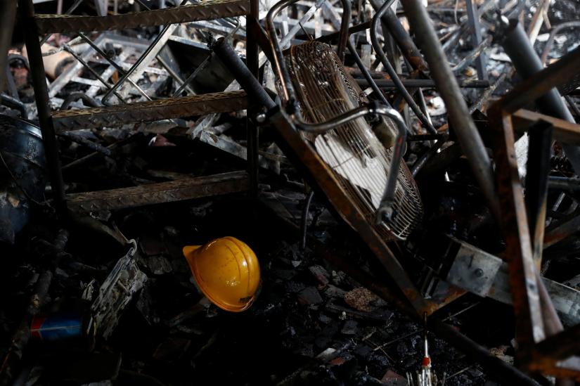 A helmet is seen among the remains of a burnt barricade in Hong Kong Polytechnic University (PolyU) in Hong Kong, China November 20, 2019. Picture taken November 20, 2019. REUTERS