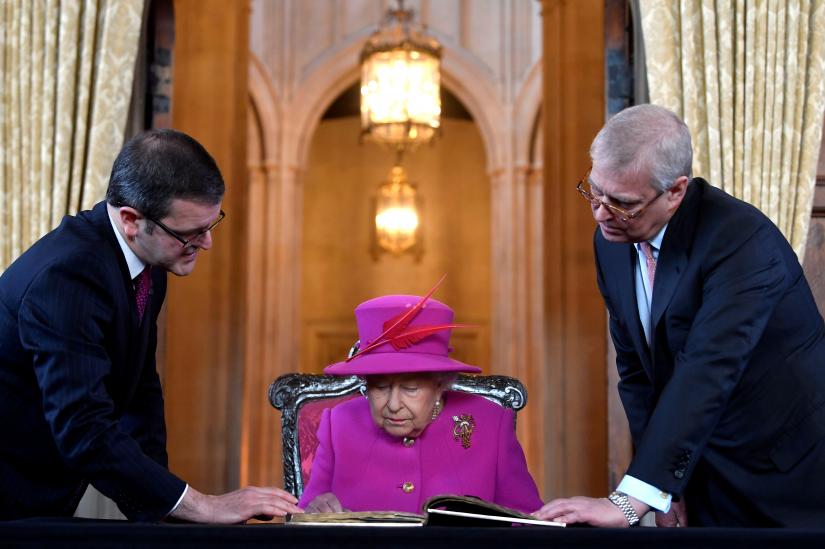 FILE PHOTO: Britain`s Queen Elizabeth, accompanied by Prince Andrew, visits The Honourable Society of Lincoln’s Inn to open the new Ashworth Centre, and re-open the recently renovated Great Hall, in London, Britain, December 13, 2018. REUTERS
