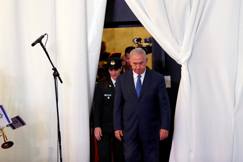 Israeli Prime Minister Benjamin Netanyahu looks on as he arrives to review an honor guard with his Ethiopian counterpart Abiy Ahmed during their meeting in Jerusalem September 1, 2019. REUTERS/File Photo
