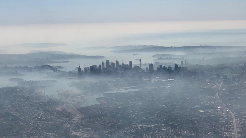 An image taken on a smart phone from a plane window shows smoke haze blanketing Sydney, Australia, Nov 19, 2019. AAP Image/Neil Bennett/via REUTERS
