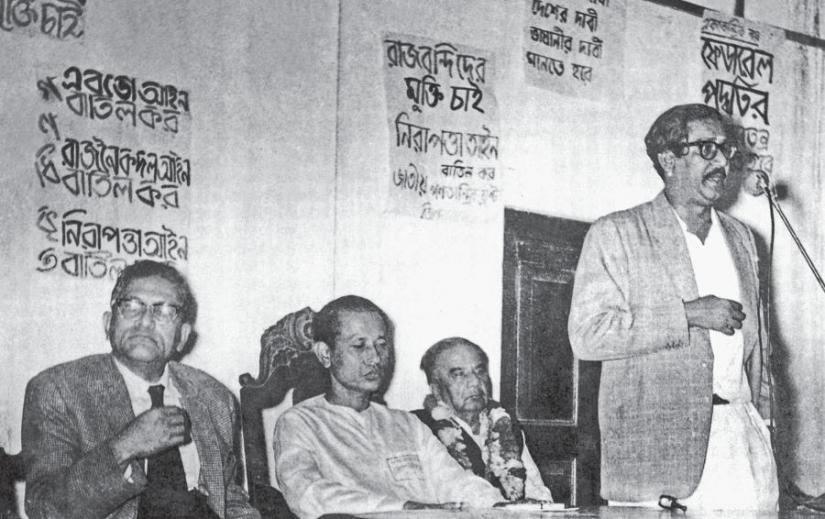 In 1962; Sheikh Mujibur Rahman is delivering a speech protesting the enforcement of EBDO by Ayub Khan. Huseyn Shaheed Suhrawardy and Hamidul Huq Choudhury also seen in the photo.