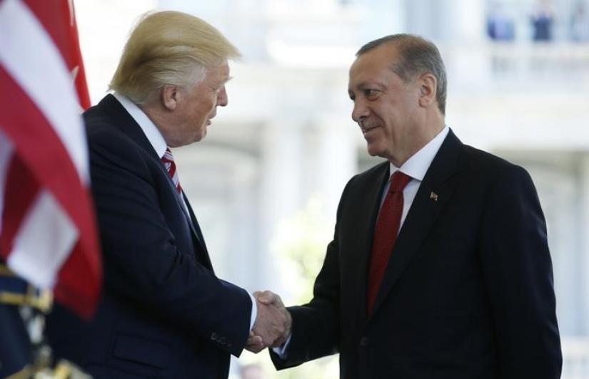 FILE PHOTO: US President Donald Trump (L) welcomes Turkey`s President Recep Tayyip Erdogan at the entrance to the West Wing of the White House in Washington, US May 16, 2017. REUTERS