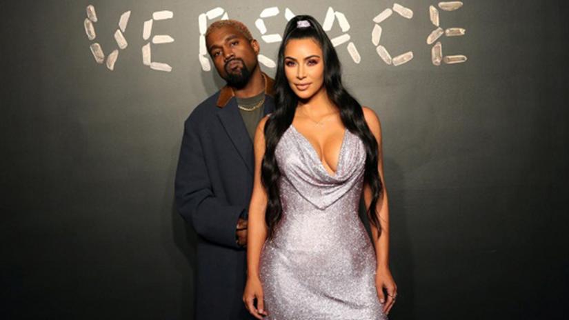 Kanye West and Kim Kardashian pose for a photo before attending the Versace presentation in New York, US on Dec 2, 2018. REUTERS/File Photo