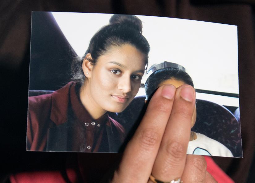 Renu Begum, sister of teenage British girl Shamima Begum, holds a photo of her sister as she makes an appeal for her to return home at Scotland Yard, in London, Britain February 22, 2015. REUTERS/File Photo