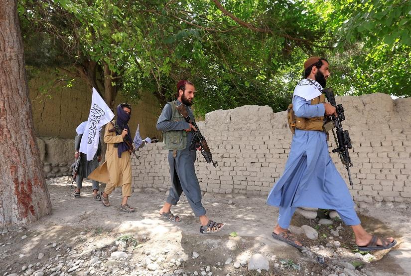 Taliban walk as they celebrate ceasefire in Ghanikhel district of Nangarhar province, Afghanistan June 16, 2018. REUTERS/File Photo
