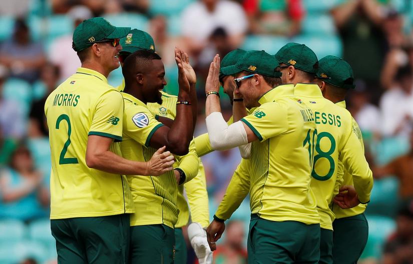Cricket - ICC Cricket World Cup - South Africa v Bangladesh - Kia Oval, London, Britain - June 2, 2019   South Africa`s Andile Phehlukwayo celebrates with teammates after taking the wicket of Bangladesh`s Tamim Iqbal   Action Images via Reuters
