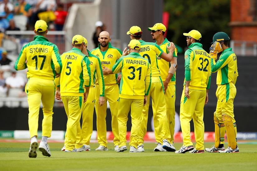 FILE PHOTO: Australia`s Nathan Lyon celebrates with Mitchell Starc and team mates after taking the wicket of South Africa`s Quinton de Kock - ICC Cricket World Cup - Australia v South Africa - Old Trafford, Manchester, Britain - Jul 6, 2019. Reuters