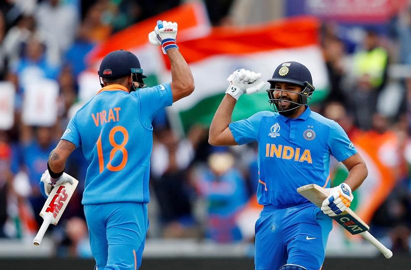 FILE PHOTO: Cricket - ICC Cricket World Cup - India v Pakistan - Emirates Old Trafford, Manchester, Britain - June 16, 2019 India`s Rohit Sharma celebrates his century with Virat Kohli Action Images via Reuters