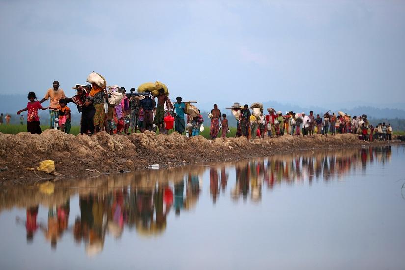 FILE PHOTO: Rohingya refugees continue their way after crossing from Myanmar into Palang Khali, near Cox`s Bazar, Bangladesh Nov 2, 2017. REUTERS