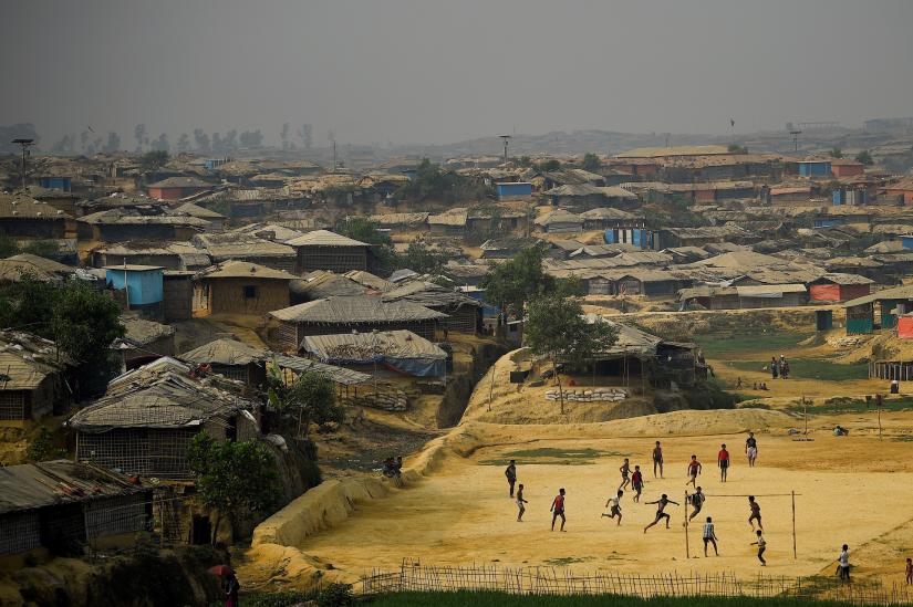 FILE PHOTO: Rohingya refugees play football at Kutupalong refugee camp in Cox`s Bazar, Bangladesh, March 27, 2018. REUTERS/File Photo