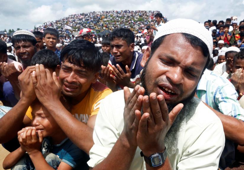 Rohingya refugees take part in a prayer as they gather to mark the second anniversary of the exodus at the Kutupalong camp in Cox’s Bazar, Bangladesh, August 25, 2019. REUTERS