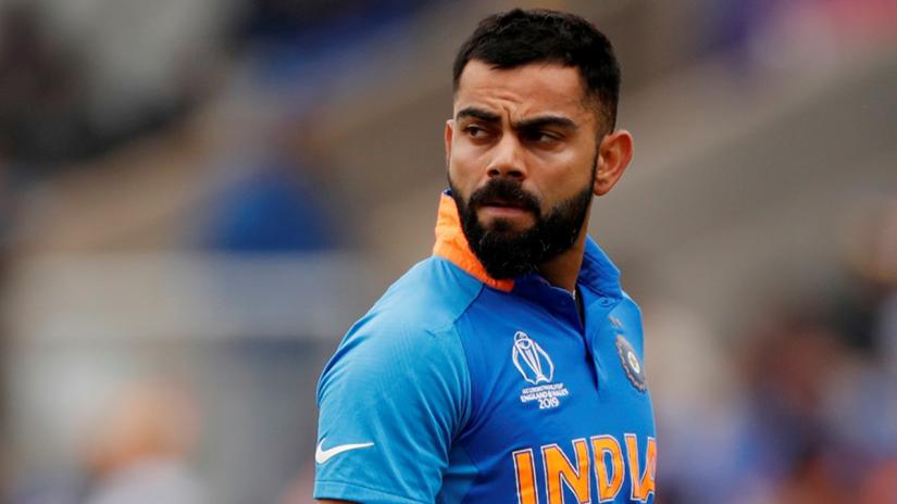 FILE PHOTO: Cricket - ICC Cricket World Cup Semi Final - India v New Zealand - Old Trafford, Manchester, Britain - July 10, 2019 India`s Virat Kohli reacts after losing his wicket Action Images via Reuters