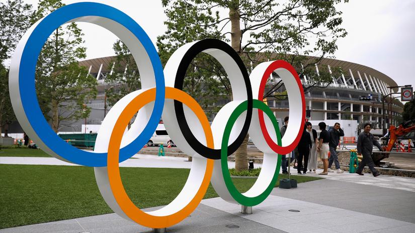 Olympic rings are displayed in front of the construction site of the New National Stadium, the main stadium of Tokyo 2020 Olympics and Paralympics, during a media opportunity in Tokyo, Japan July 3, 2019. REUTERS/File Photo